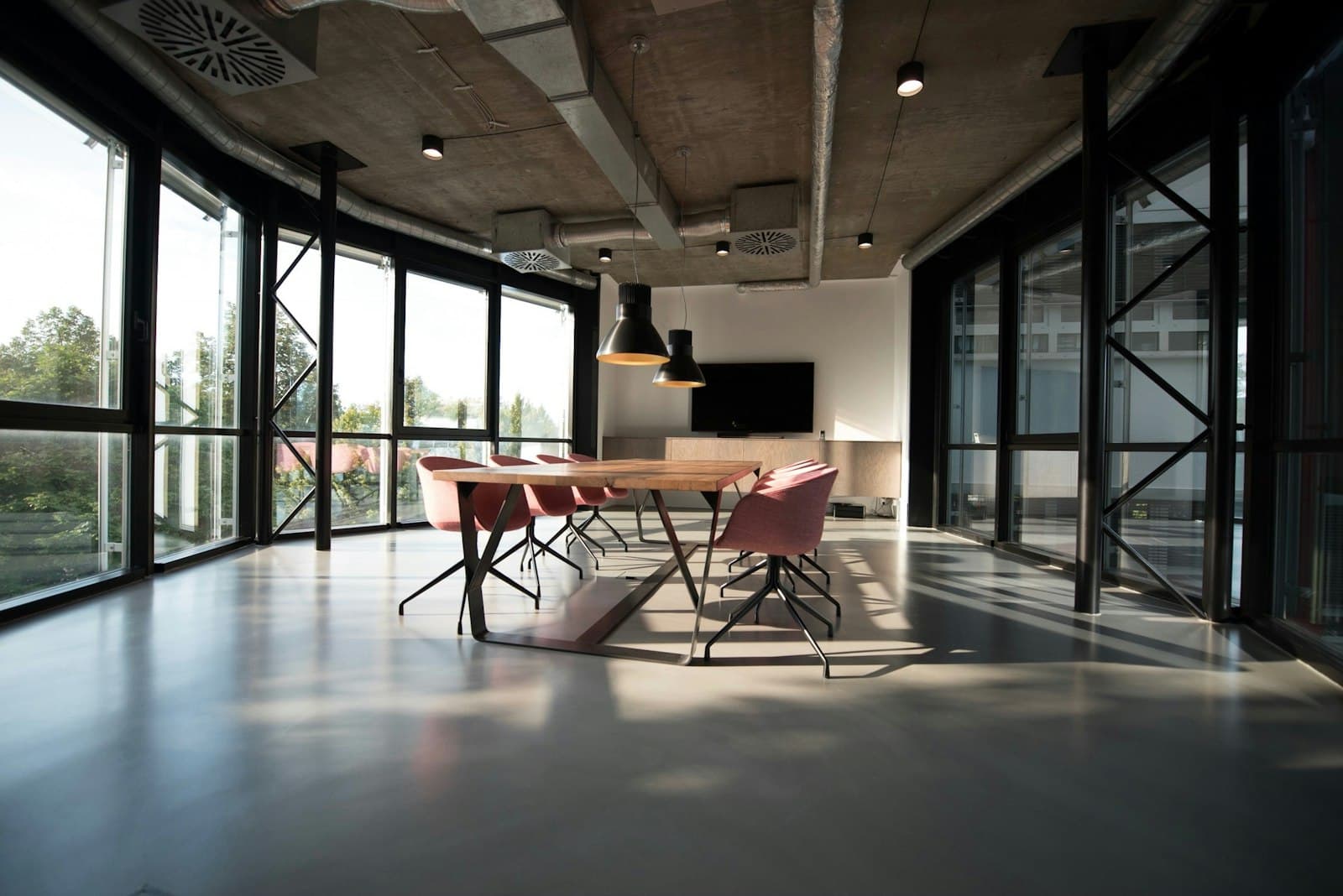Glass-walled boardroom at golden hour