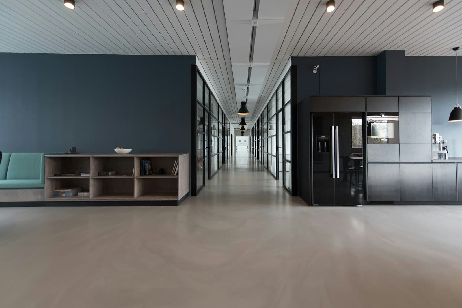 Adverli's dark, modern office corridor