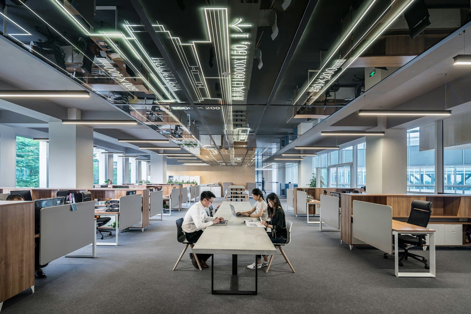 Modern open-plan office with teams at work
