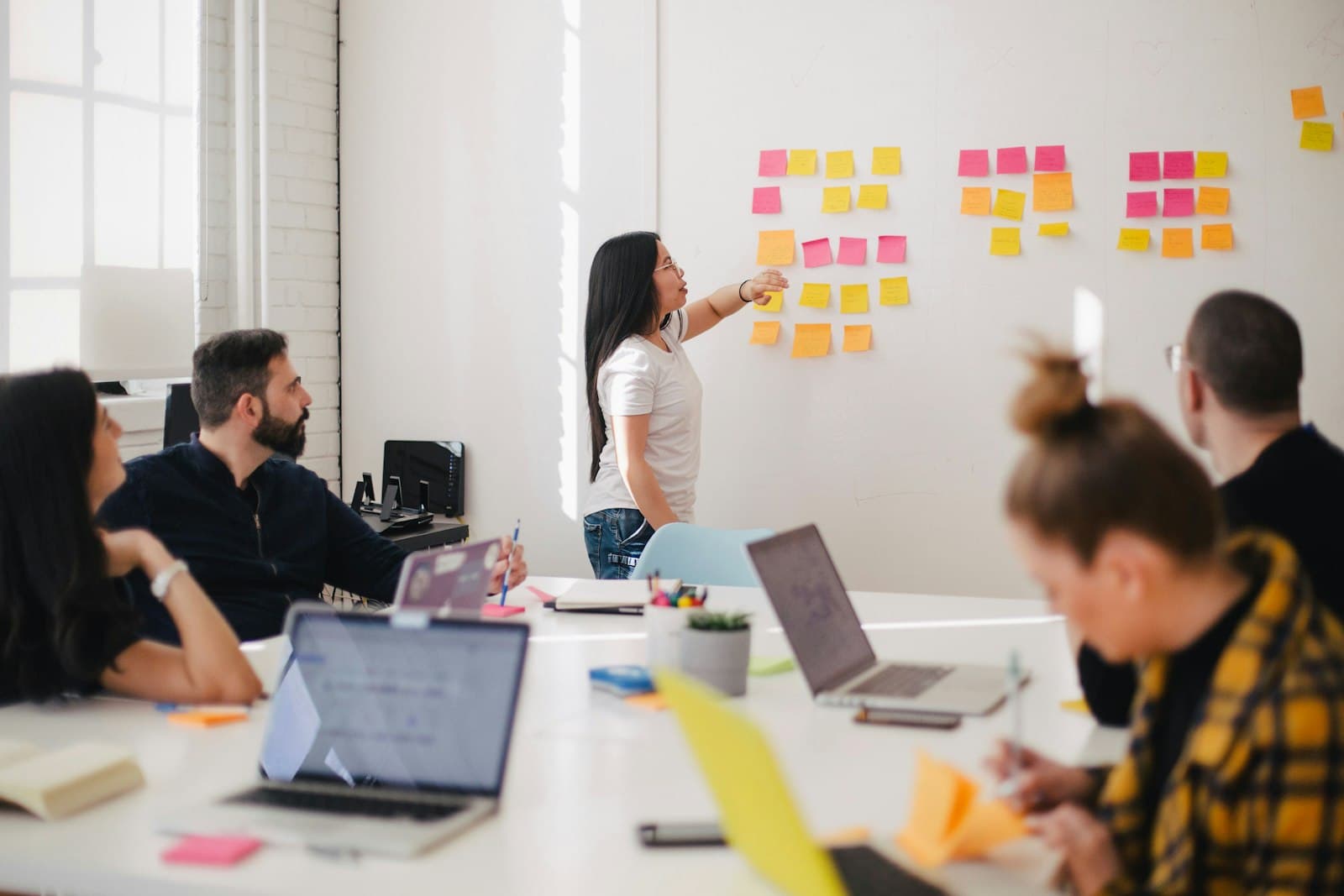 Team mapping campaign strategy on a wall of sticky notes